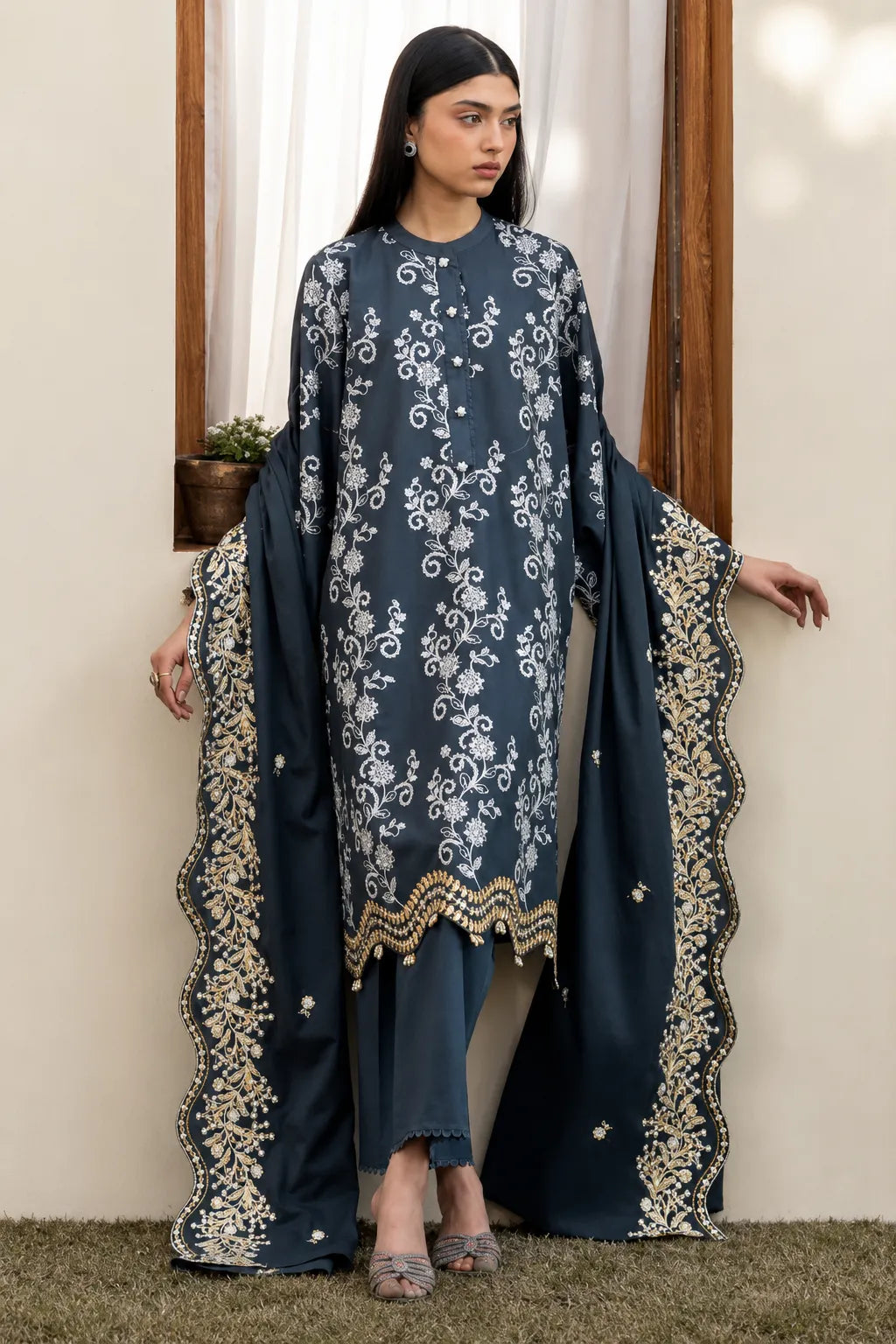 Cross Stitch charcoal grey embroidered lawn 3-piece suit with floral embroidery and embroidered chiffon dupatta.